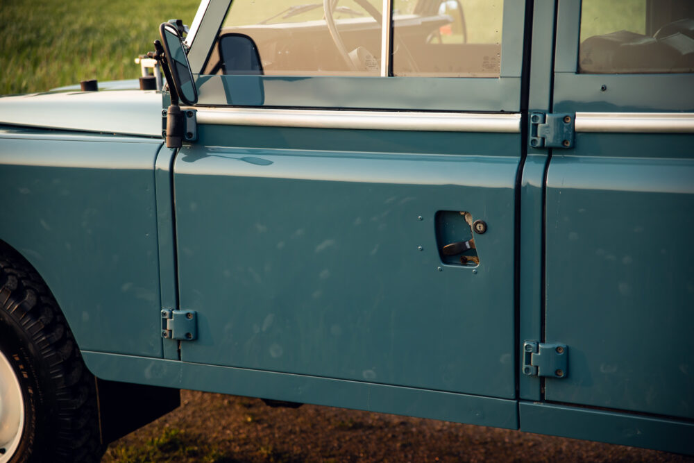 Vintage blue SUV door and window detail