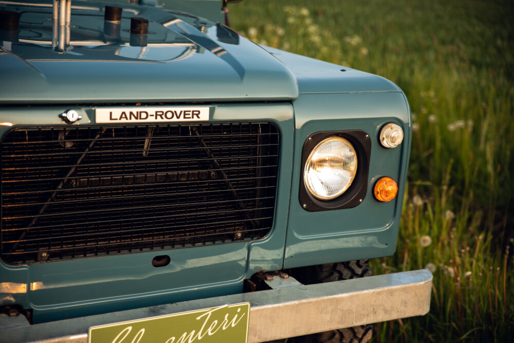 Close-up of vintage teal Land Rover front