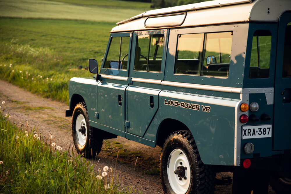 Vintage Land Rover V8 parked on rural road