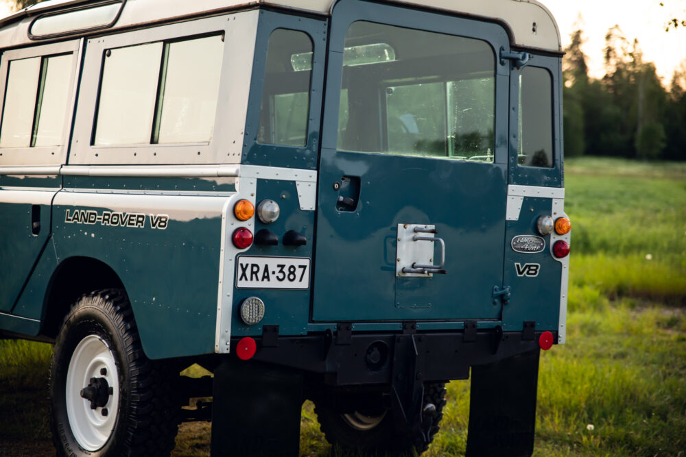 Vintage Land Rover V8 in a lush green field