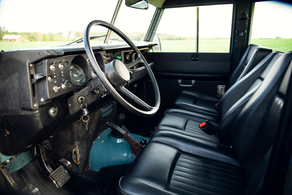 Vintage vehicle interior with steering wheel and dashboard