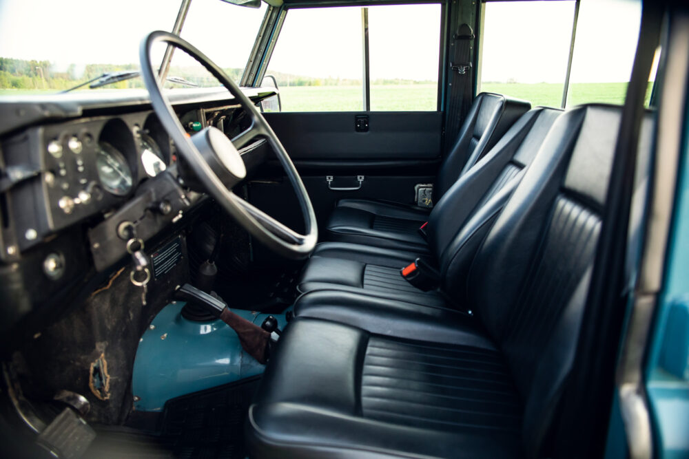 Vintage vehicle interior with black leather seats