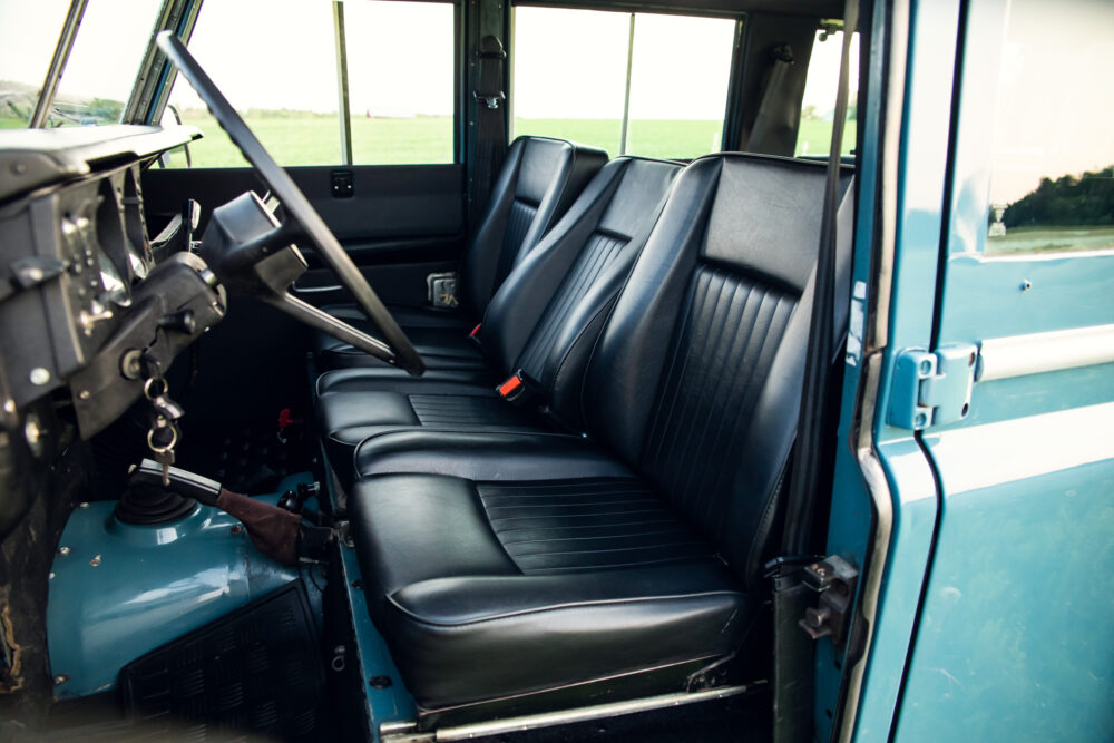 Vintage blue truck interior with black leather seats