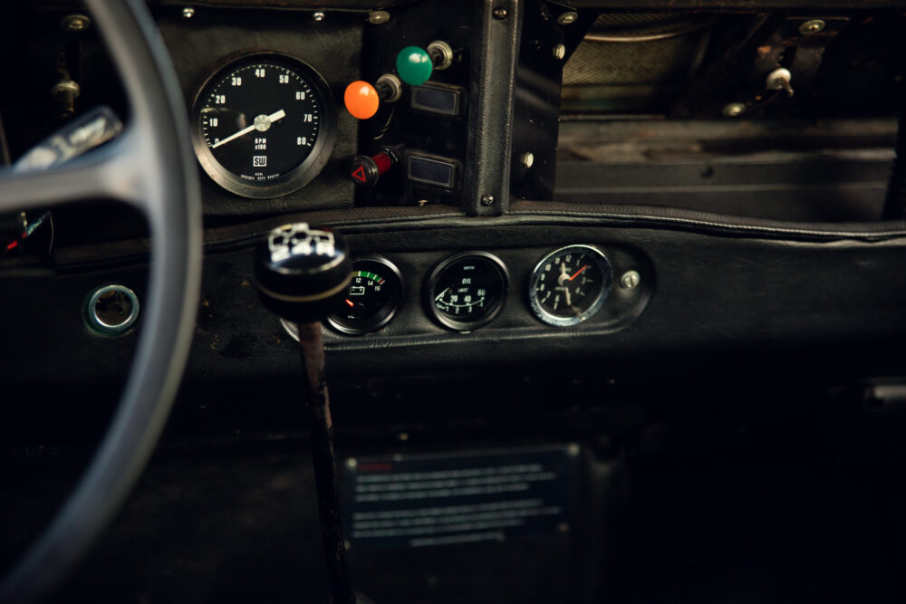 Vintage car dashboard with gauges and steering wheel