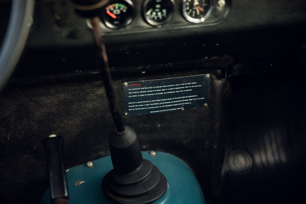 Vehicle interior with warning label and gear shift