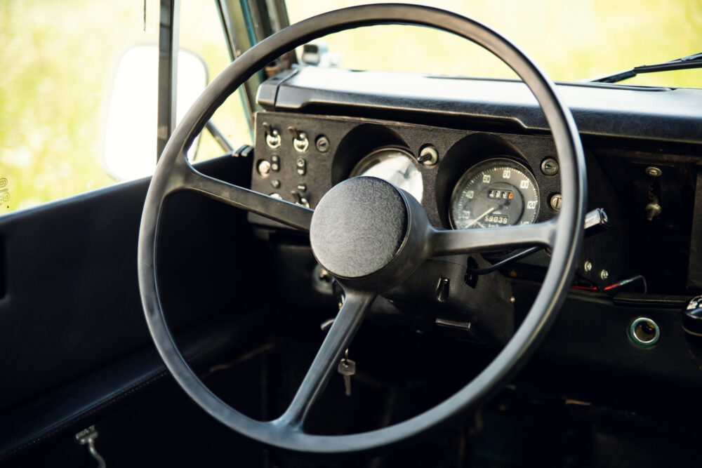 Close-up of classic car dashboard and steering wheel