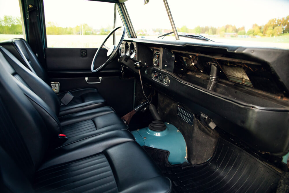 Vintage car interior with black seats and dashboard