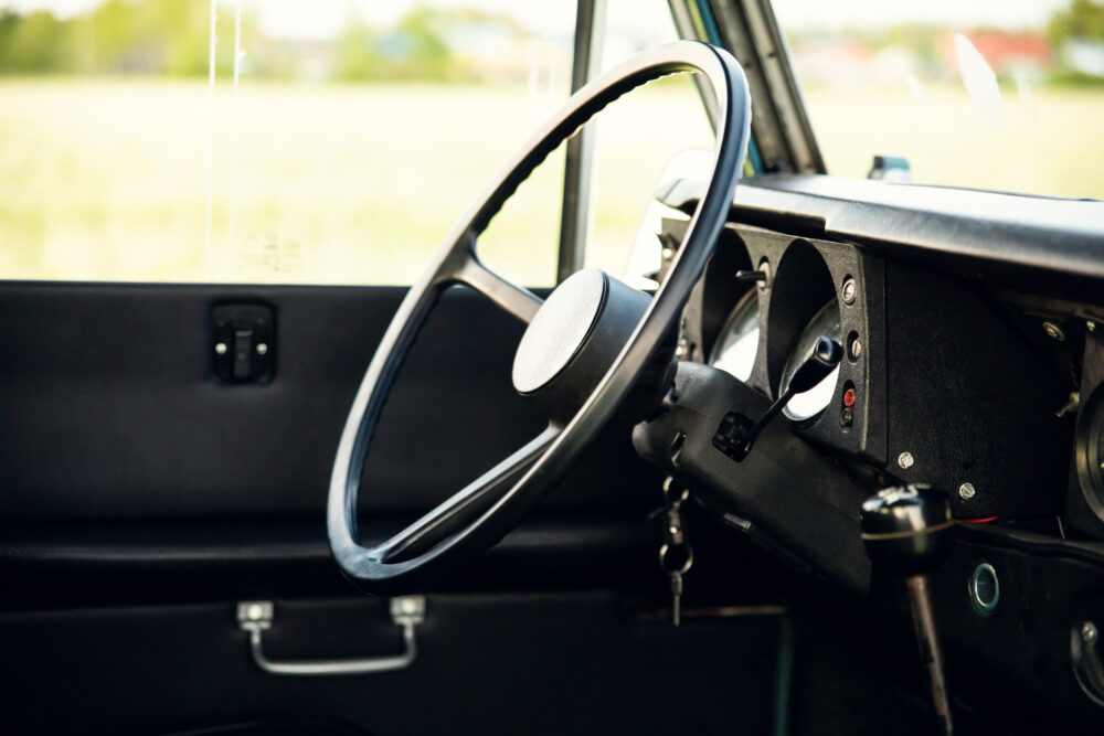 Vintage car interior with steering wheel and dashboard