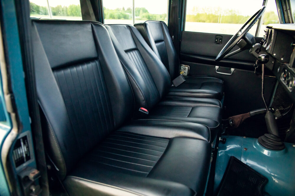 Vintage car's sleek black leather rear seats