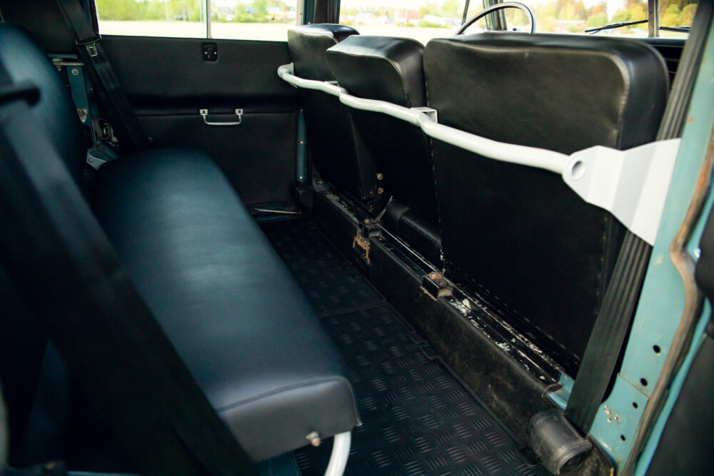 Vintage van interior with black seats and white handle