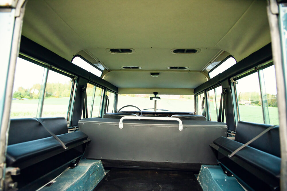 Empty vintage bus interior on sunny day