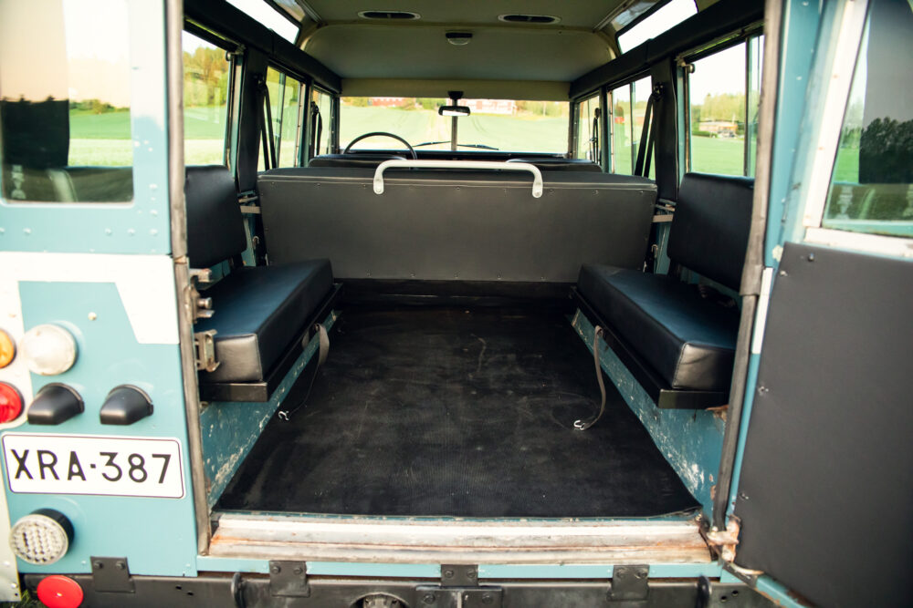 Interior of vintage bus with empty seats and steering wheel