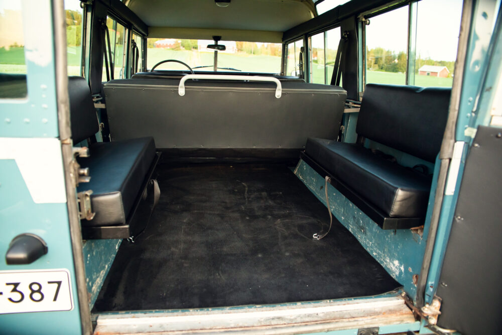 Interior of vintage blue bus with empty seats