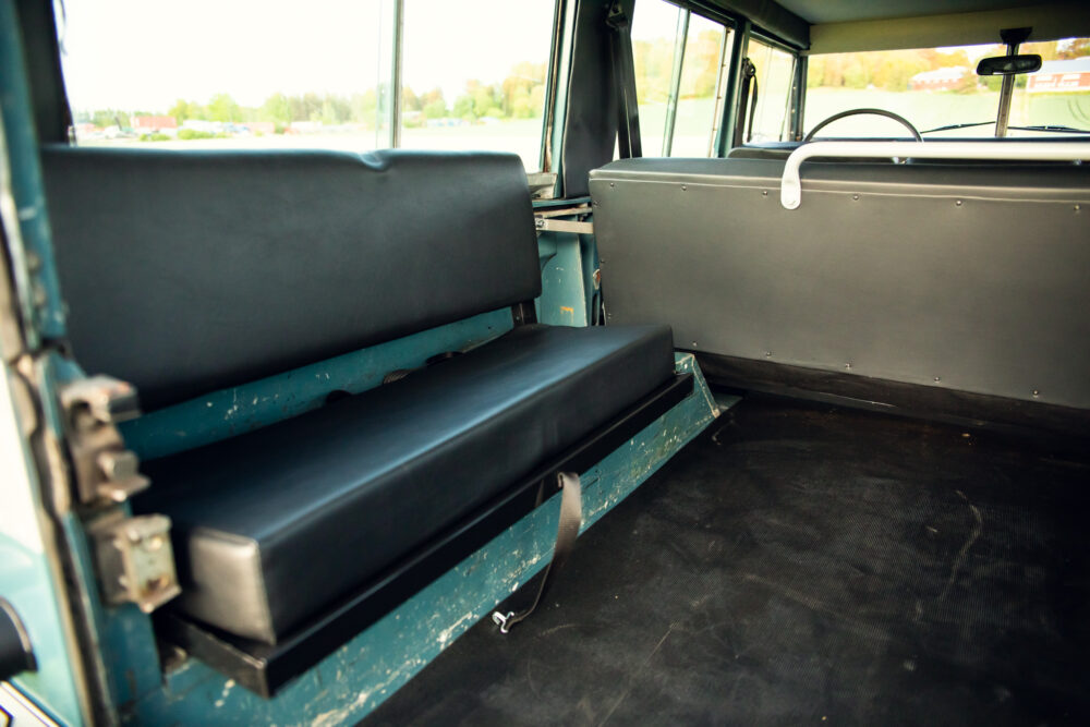 Interior view of vintage bus with black seats