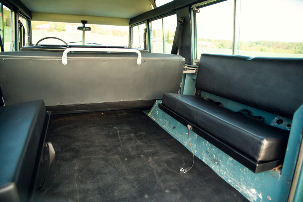 Empty vintage bus interior with blue seats