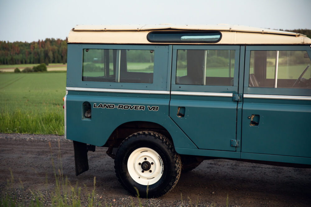 Vintage Land Rover V8 parked on country road