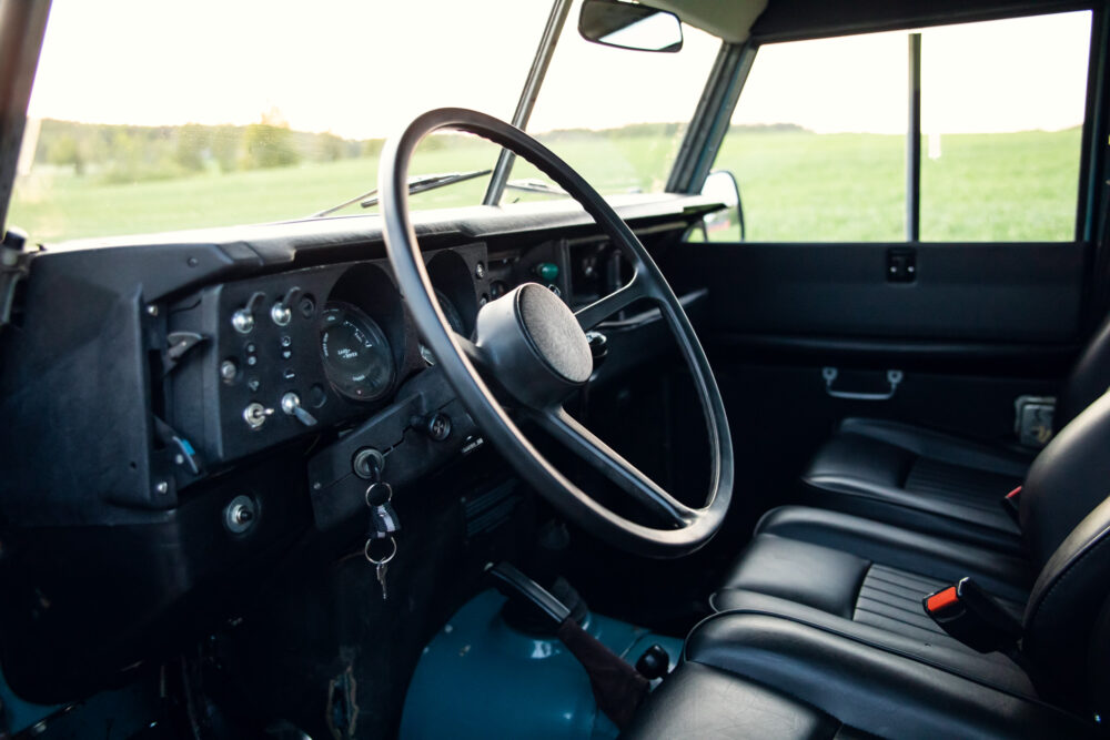 Vintage car interior with steering wheel and dashboard