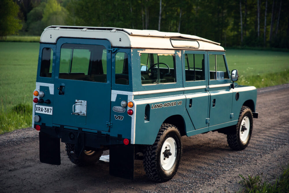 Vintage blue Land Rover V8 on a country road