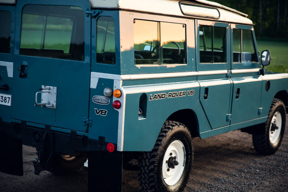 Classic blue Land Rover V8 parked outdoors