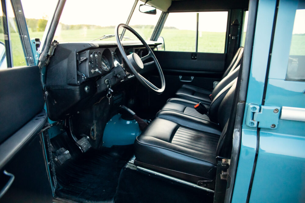 Interior view of classic blue truck with open door