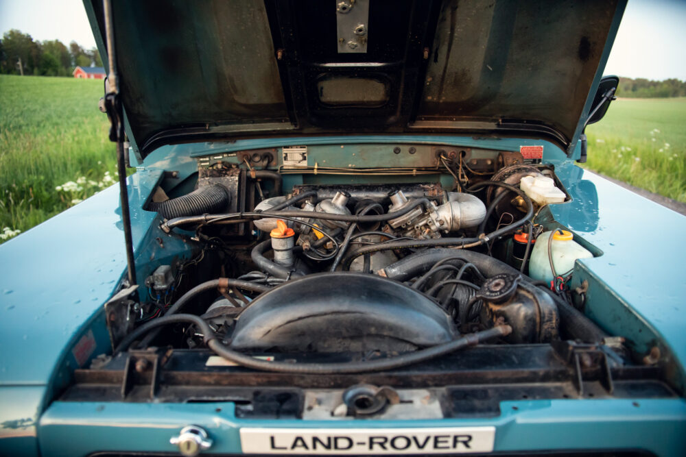 Open hood of a Land Rover displaying engine