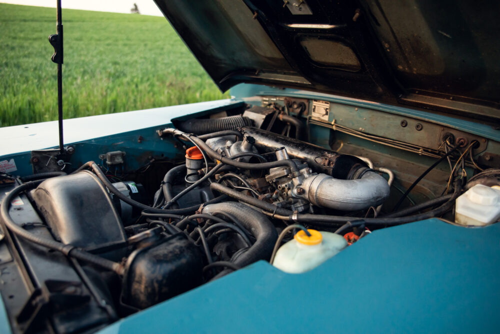 Open car hood showing detailed engine components