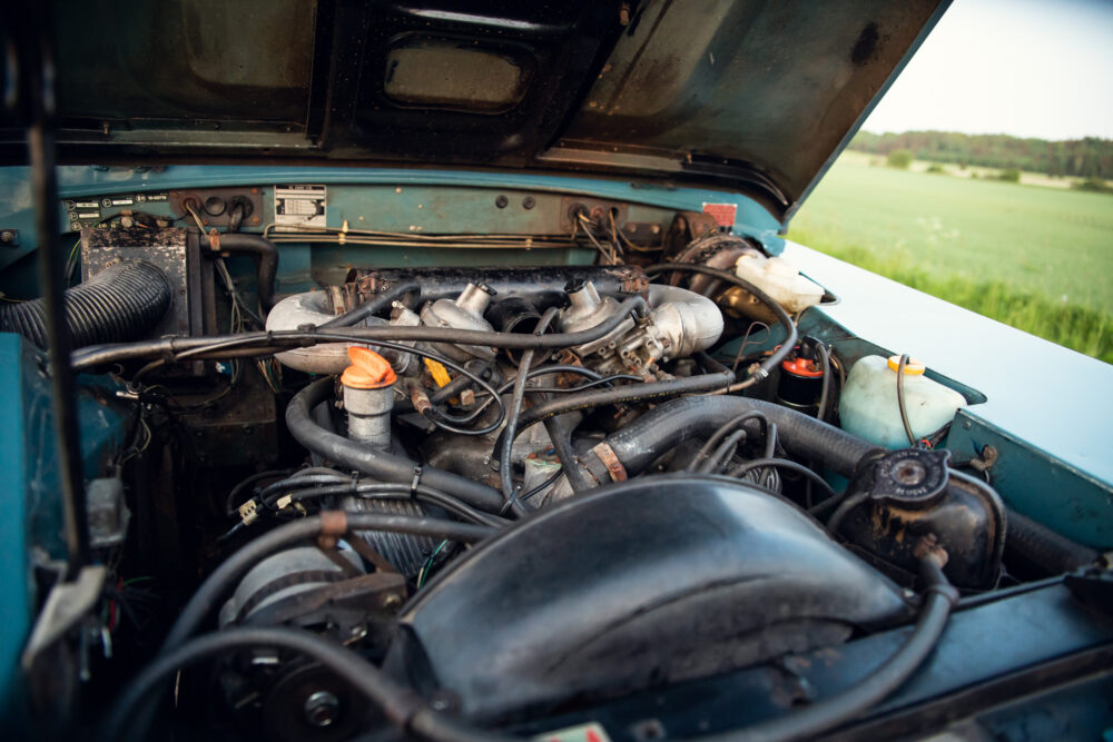 Detailed view of old car engine compartment