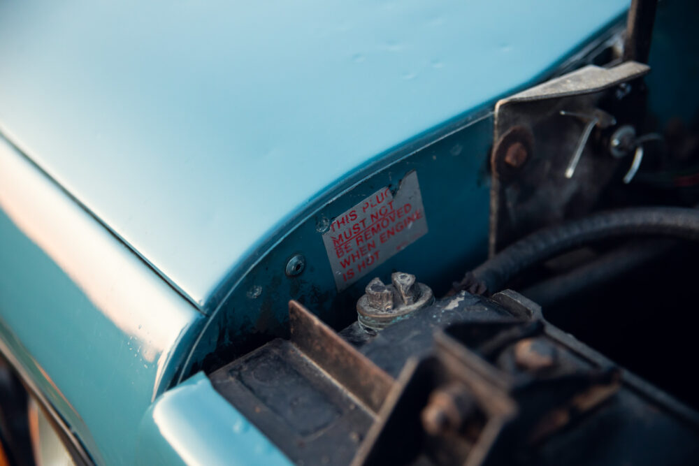 Warning label inside a car engine compartment