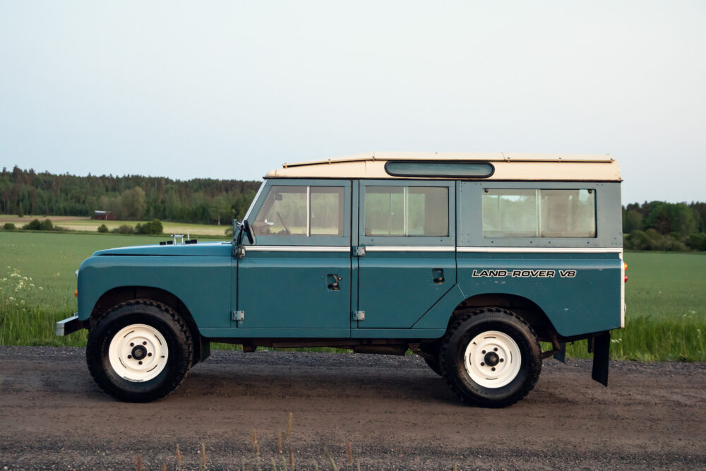 Vintage blue Land Rover V8 in rural setting