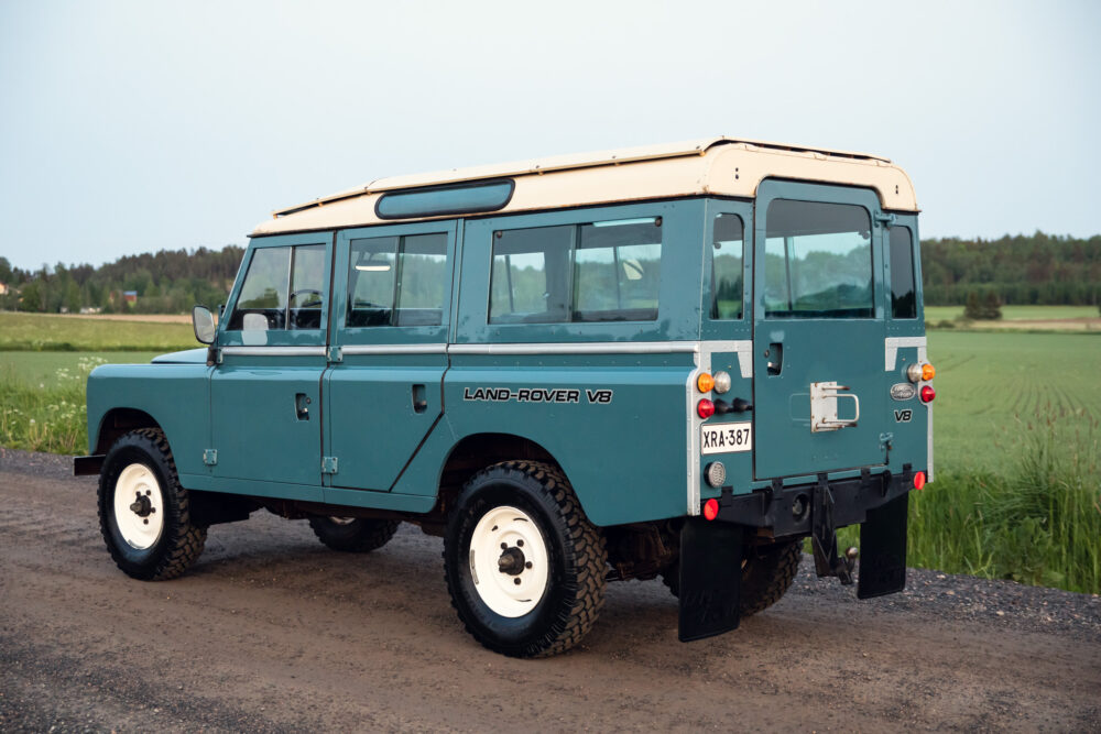 Vintage blue Land Rover V8 on country road