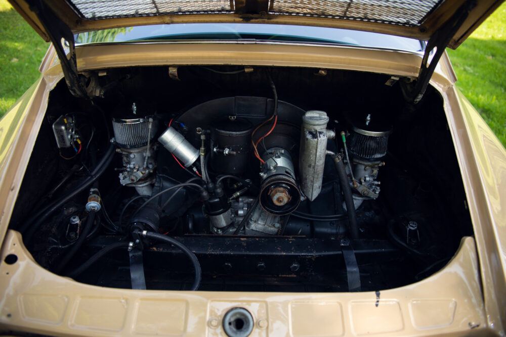 Open car hood showing detailed vintage engine compartment