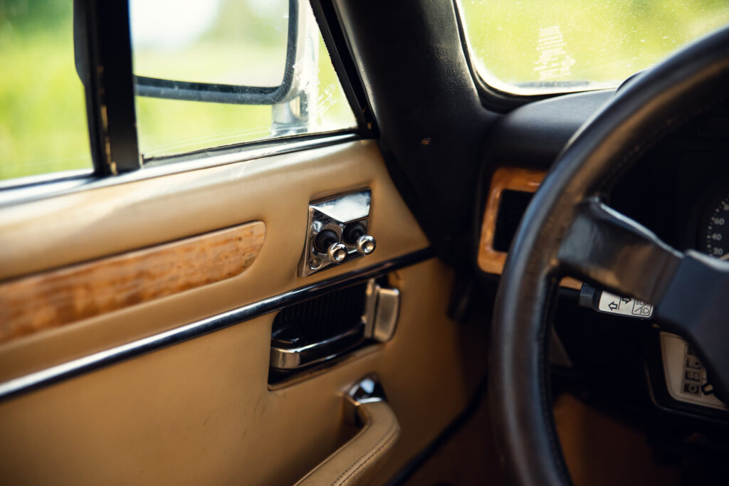 Vintage car's interior with steering wheel and dashboard