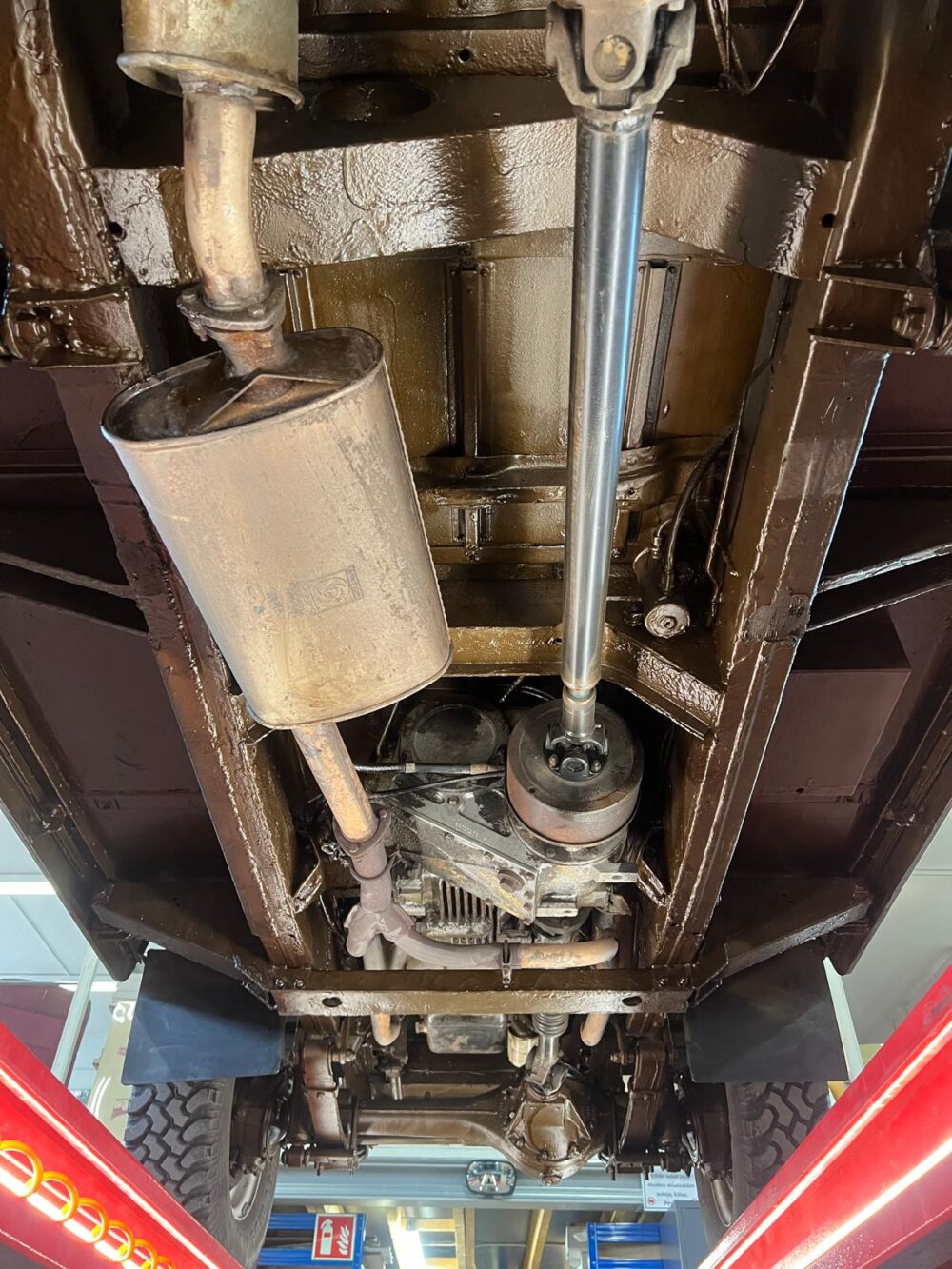 Undercarriage view of a vehicle showing exhaust and suspension