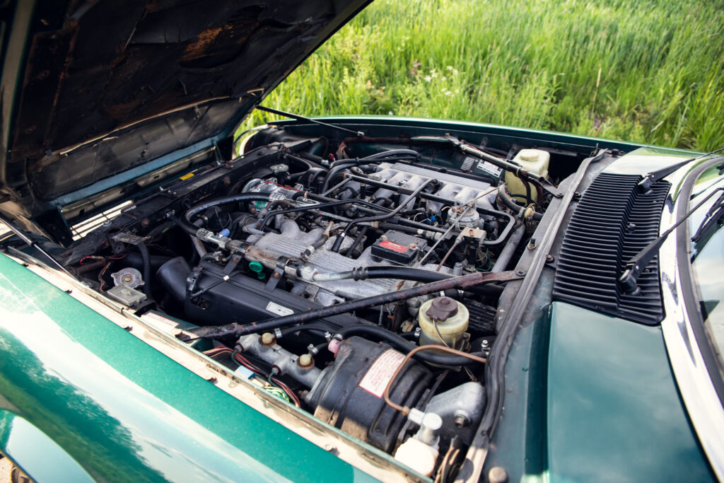 Open car hood showing detailed engine compartment