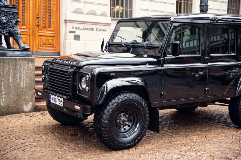 Black Land Rover Defender parked near building