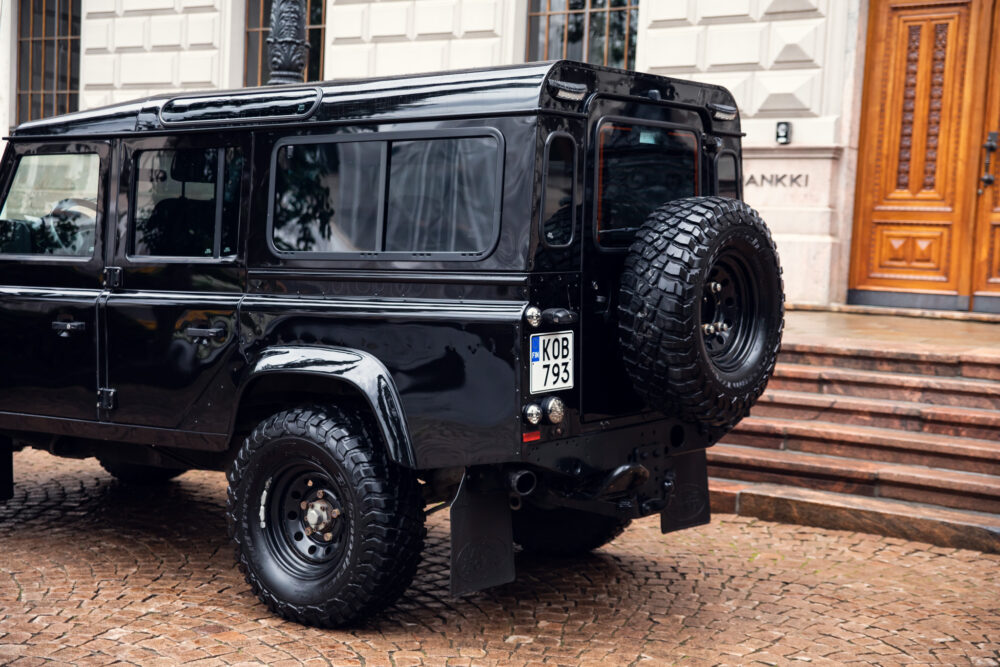 Black SUV parked near building entrance