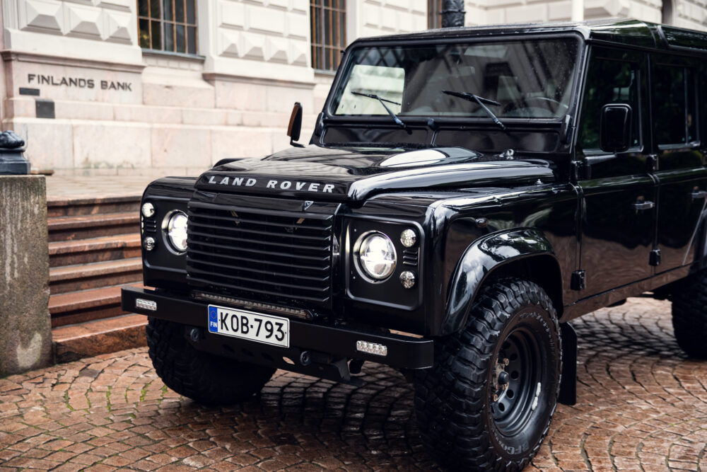 Black Land Rover Defender parked near Finland's Bank