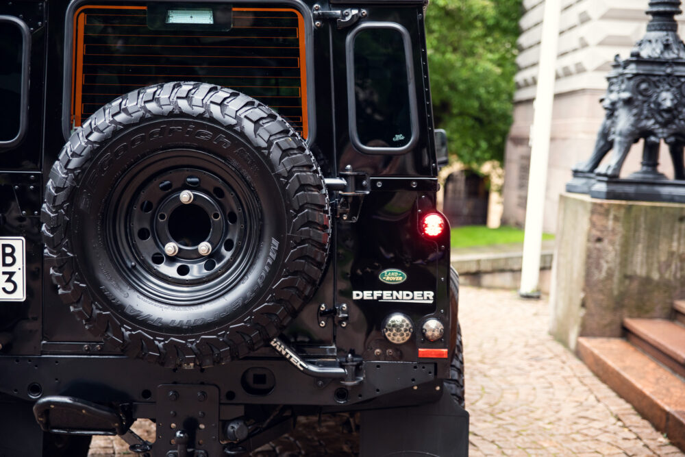 Land Rover Defender with spare wheel in urban setting
