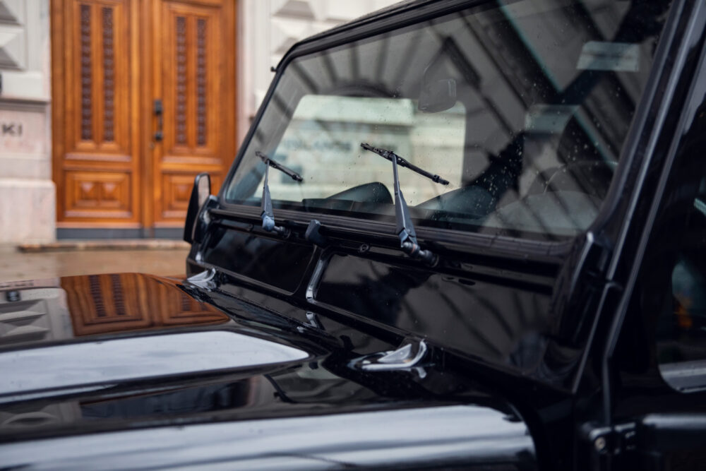 Close-up of vintage car windshield and wipers