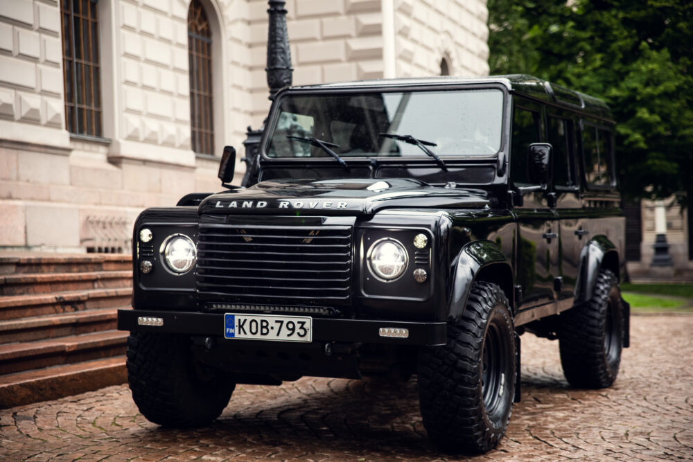 Black Land Rover Defender parked near building