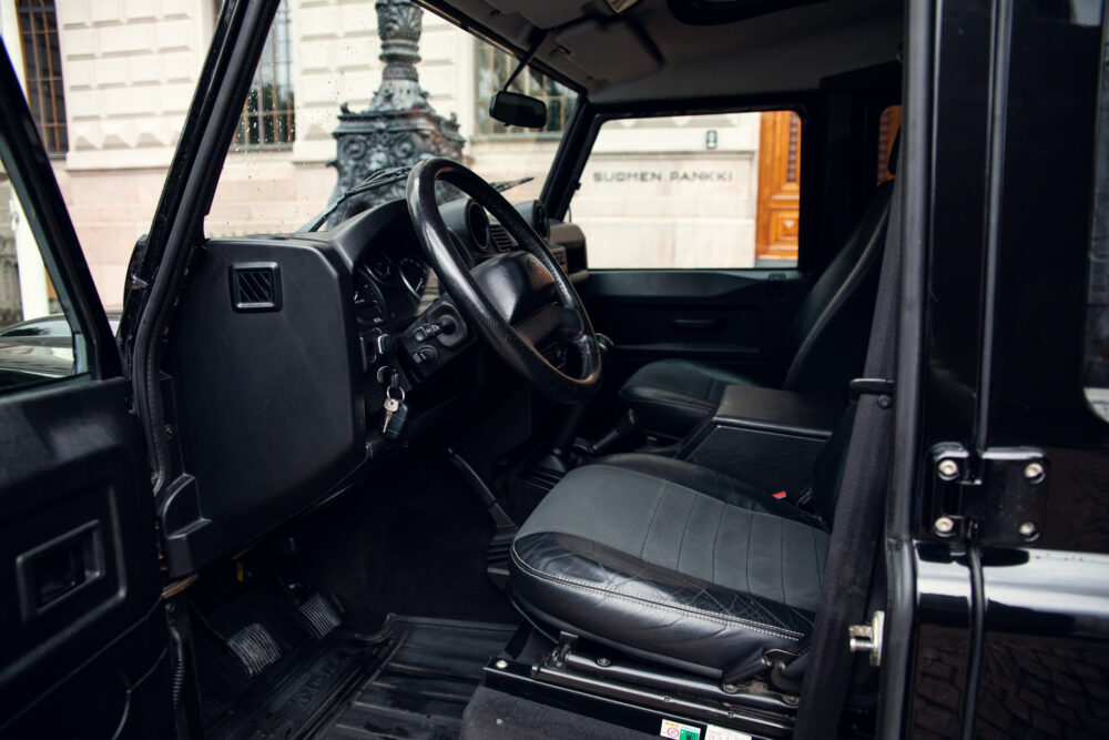 Open door view inside a car with leather seats
