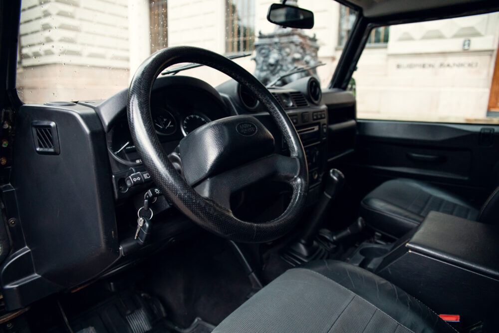 Interior view of vintage car with steering wheel