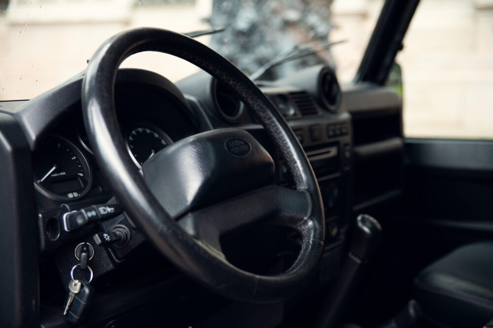 Vintage car interior with steering wheel and dashboard