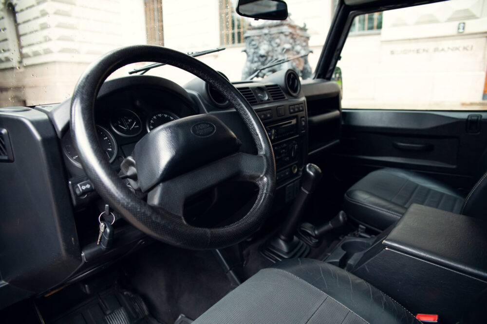 Interior view of a Land Rover with steering wheel and dashboard