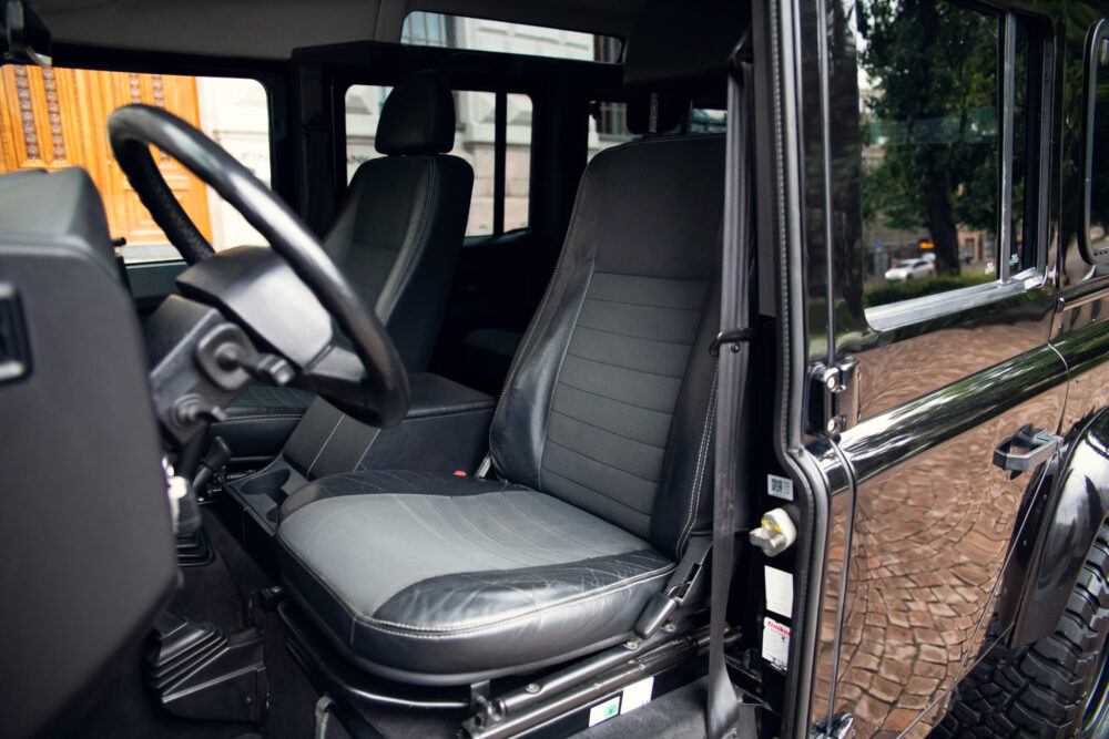 Interior view of an open door luxury SUV