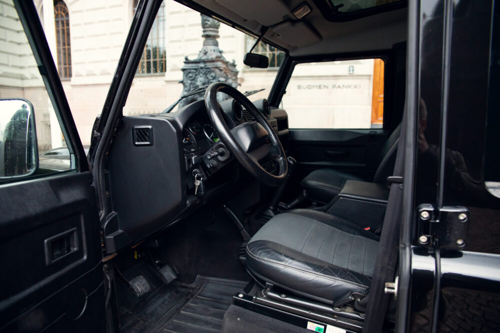 Interior view of an open-door black SUV