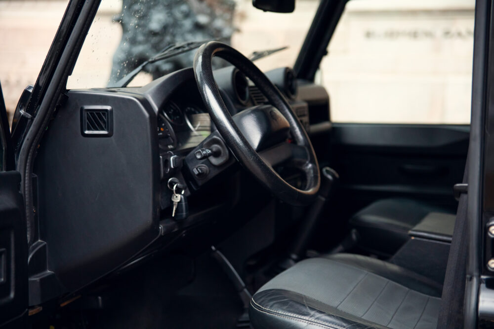 Interior view of an open-door black vehicle