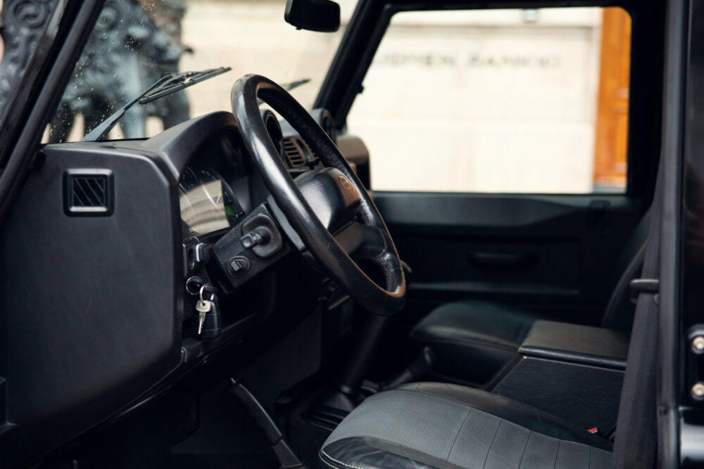 Interior view of car with steering wheel and keys