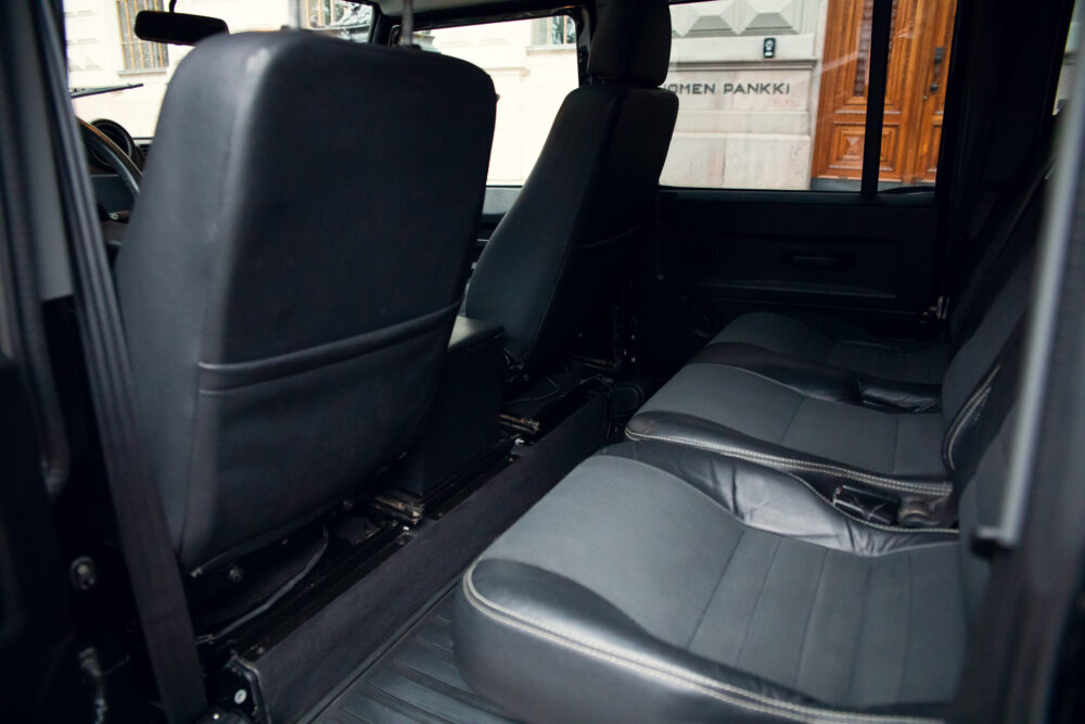 Interior of a vehicle showing black leather seats