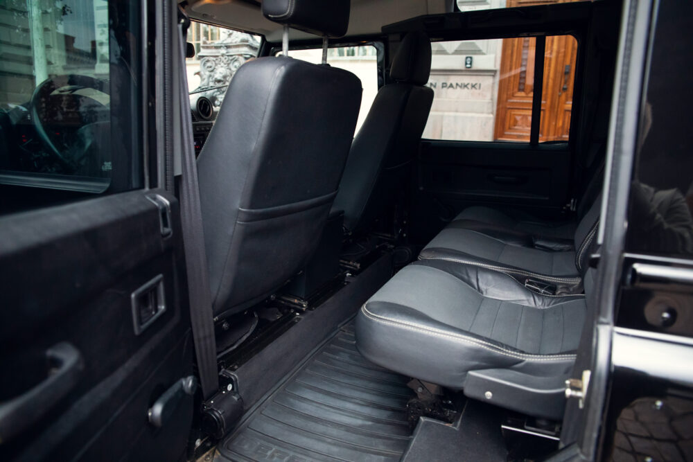 Open van door showing interior leather seats and floor